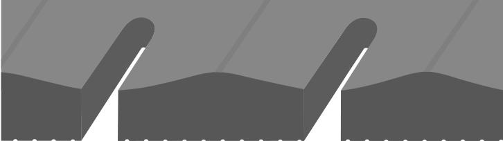 Eine schwarze Gummimatte mit Längsschlitzen, angeschnitten, darunter Betonrot mit kufenartigen Ausstülpungen und zur Matte deckungsgleiche Löcher, verlegt in einem Stall